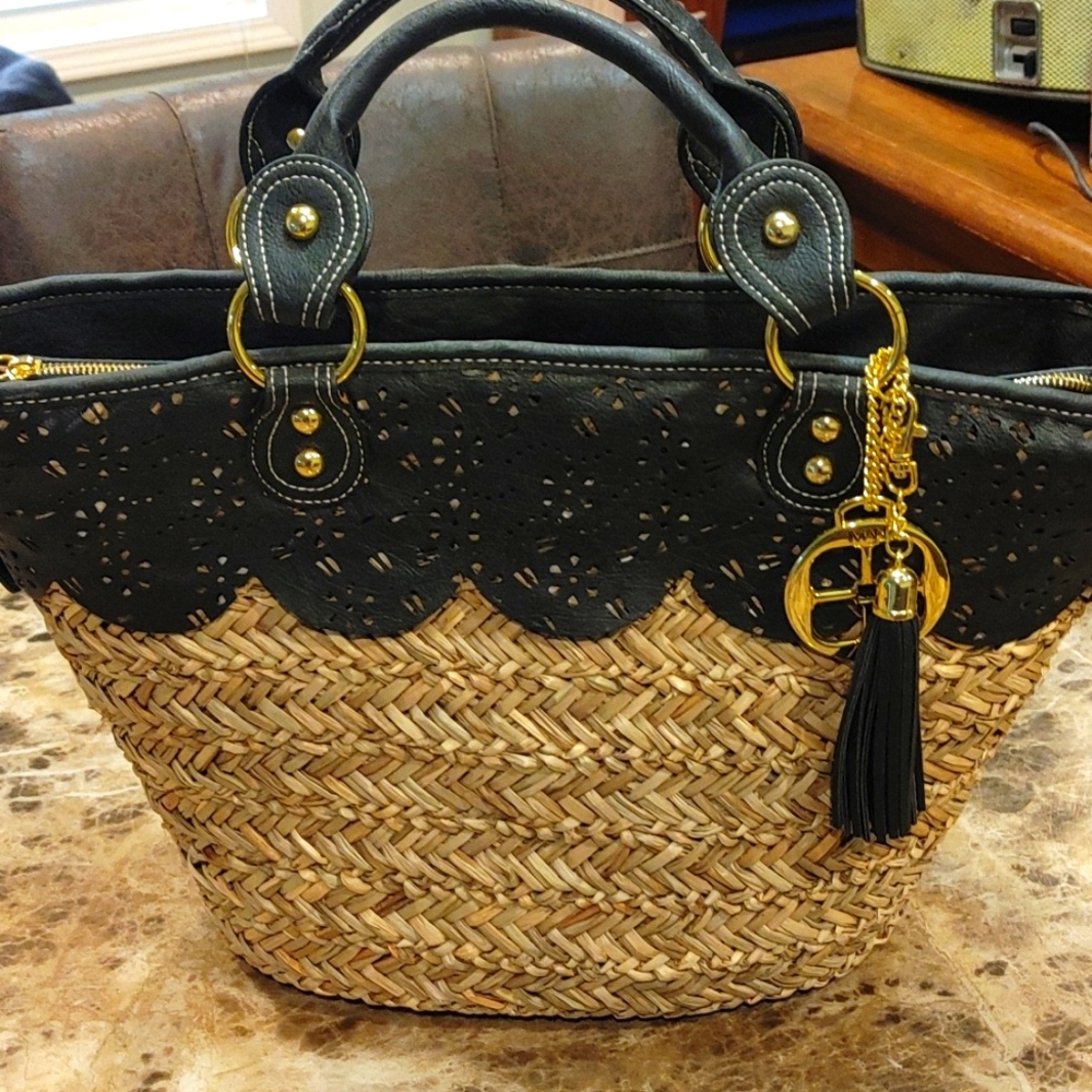 Iman Global Chic ResortWoven tote with black leathered laser cut detailing. New.
